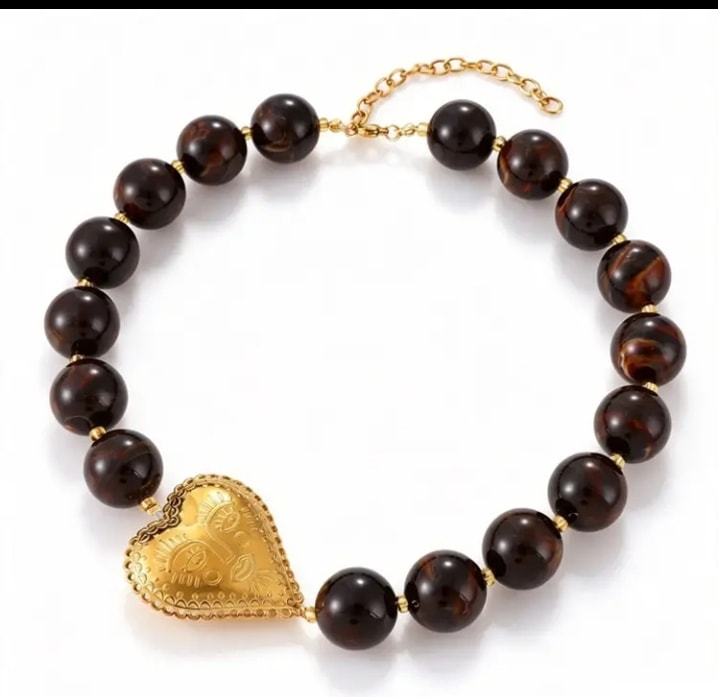 Pulsera con cuentas ojo de tigre y corazón dorado filigranado